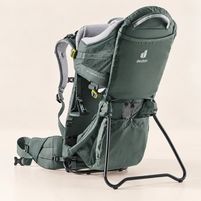A framed hiking baby carrier on a light background.