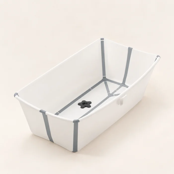 A foldable baby bath on a light background.